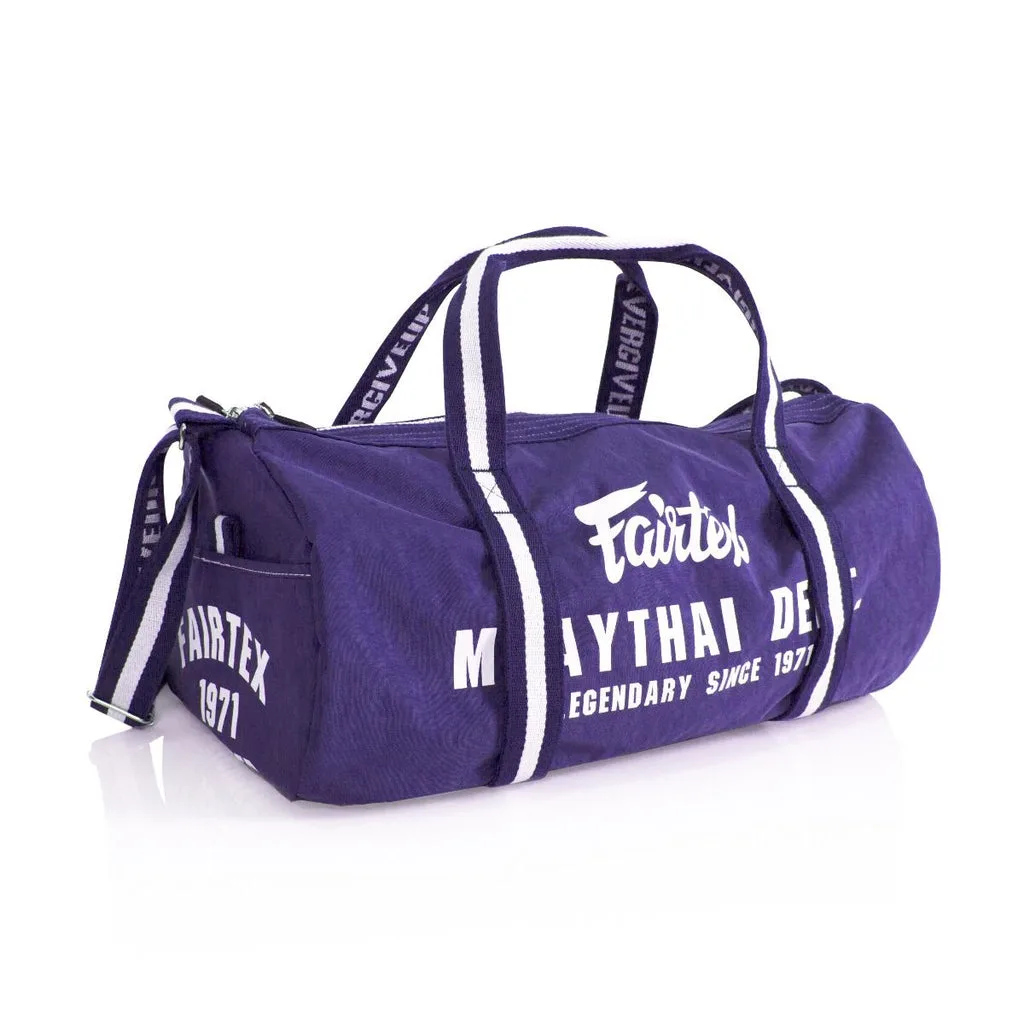 Fairtex Barrel Bag в лилав цвят, показан отпред, с логото на Fairtex и видими джобове, подходящ за фитнес и ежедневие.