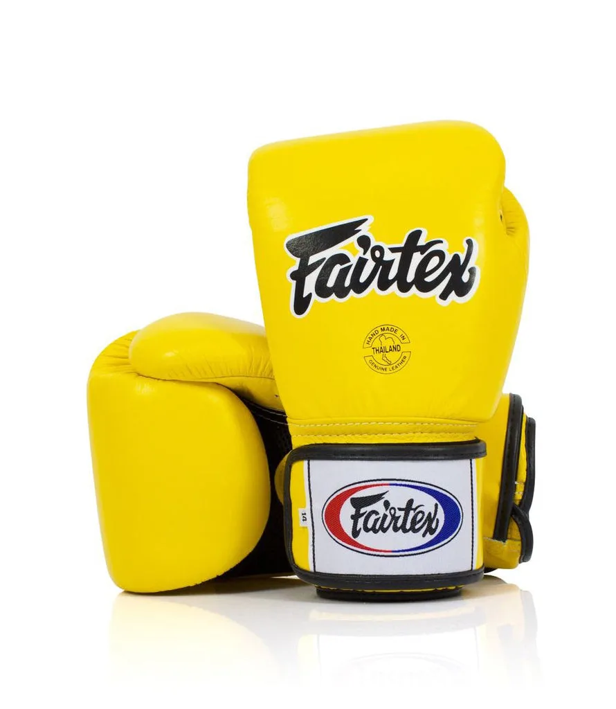 Жълти боксови ръкавици Fairtex BGV1, изработени от естествена кожа, с видими вентилационни отвори на дланта и логото на Fairtex.