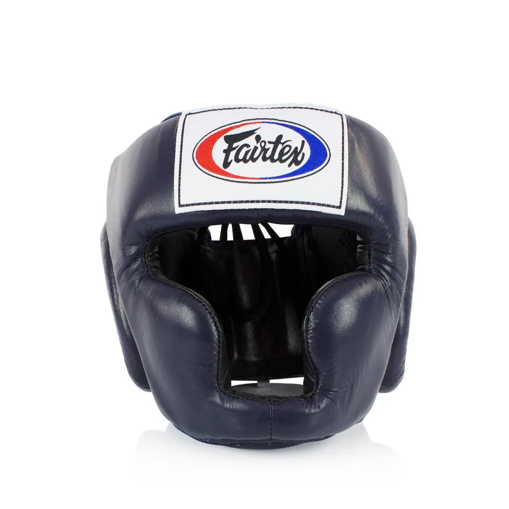 Син протектор за глава Fairtex Full Coverage Headguard HG3, показан отпред, с ясно видими зони за защита на бузи, брадичка и уши.