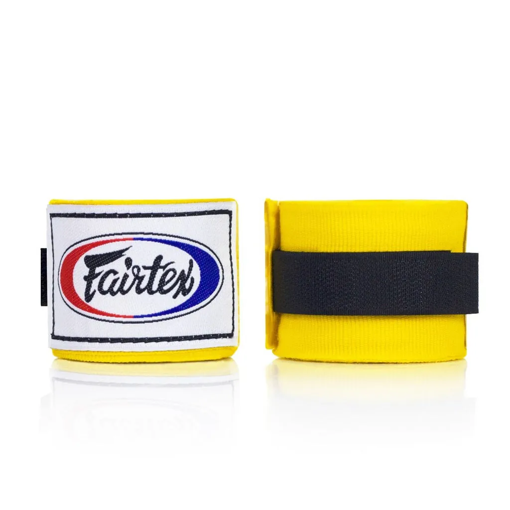 Fairtex HW2 жълти бинтове за ръце, навити на руло, показващи меката памучна материя и яркожълтия цвят.
