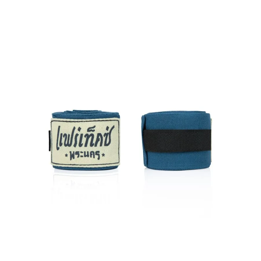 Fairtex Бинтове Phra Nakhon Set of 3 HW2PNK в цвят Indigo, с винтидж лого на Fairtex и надпис Phra Nakhon, поставени върху дървена повърхност