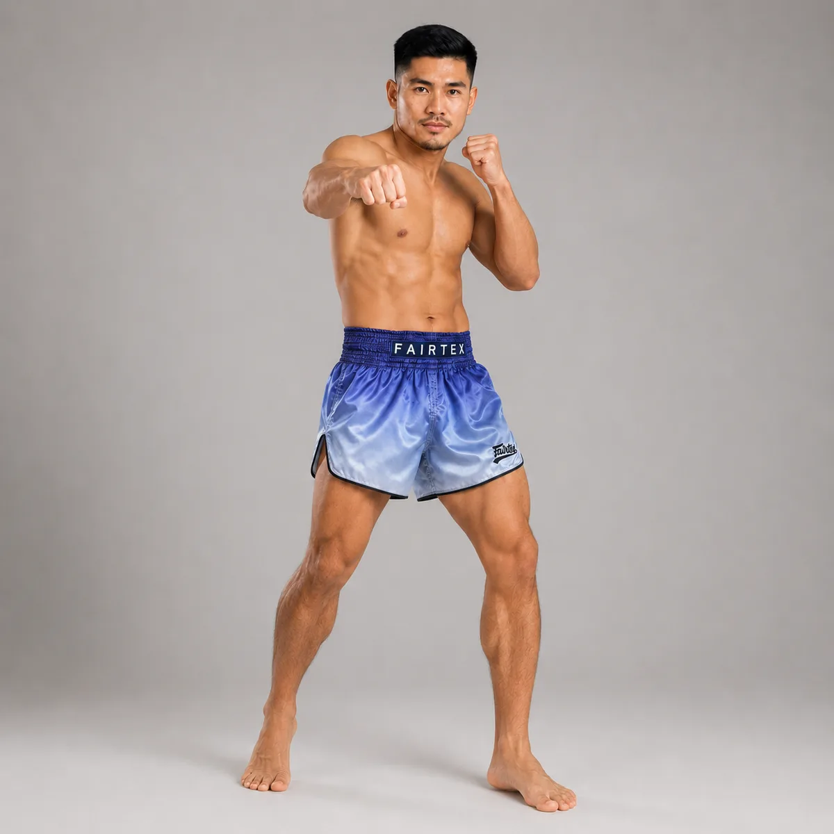 Детайл на еластичния колан и шевовете на Fairtex Muay Thai шорти FADE Blue