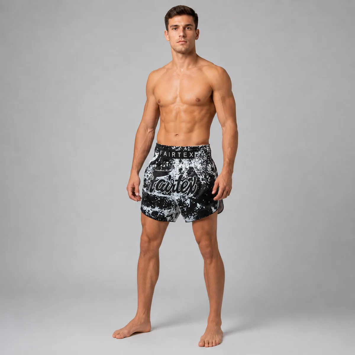 Близък план на колана на шортите Fairtex Grunge Black BS1949, показващ еластичността и логото на марката.