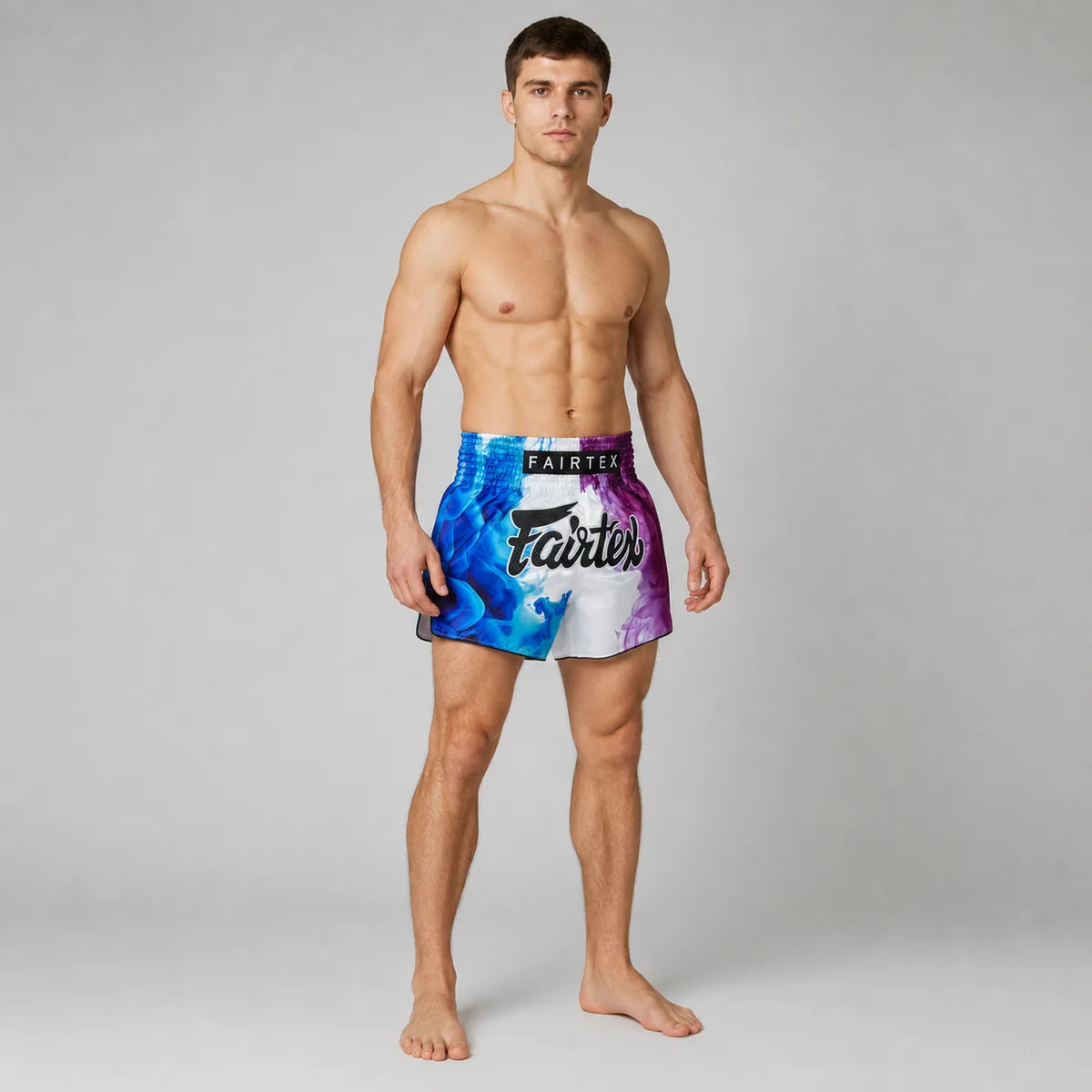 Fairtex Muay Thai шорти White Tech House, показани с акцент върху еластичния колан.