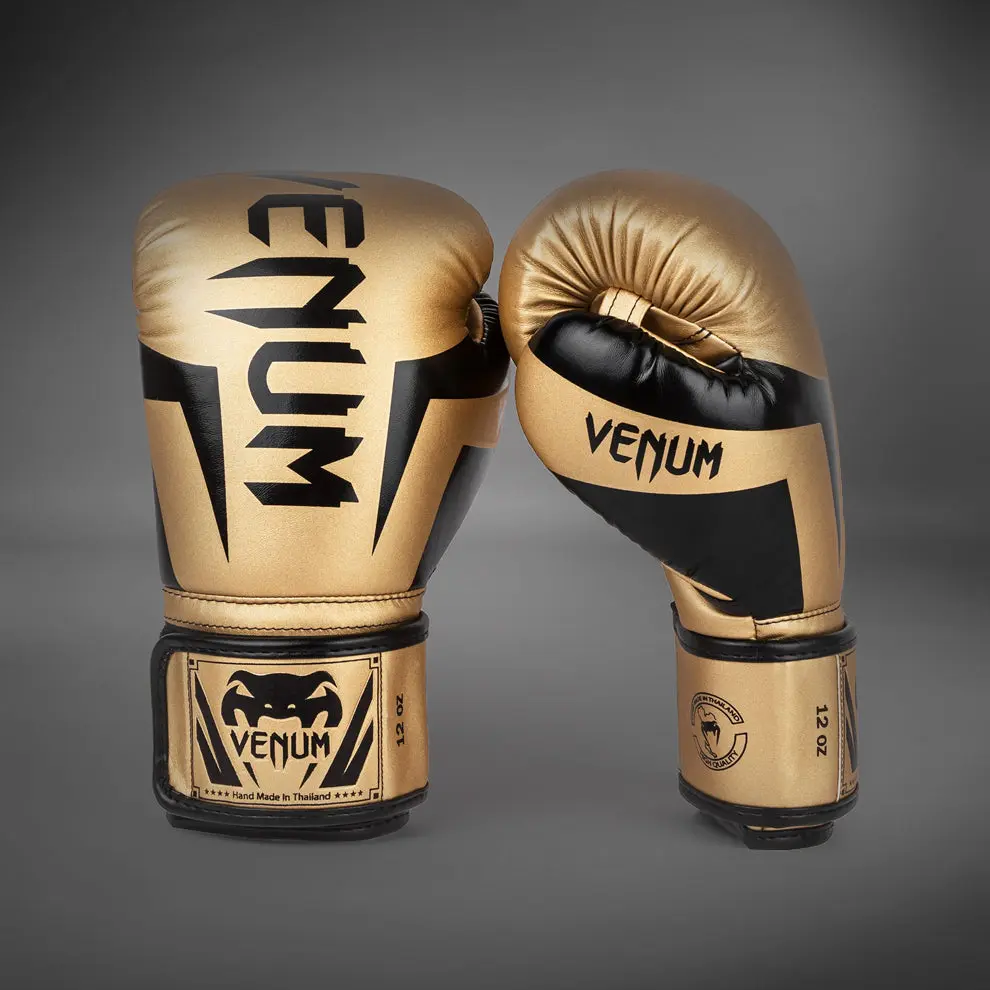 Venum Elite Boxing Gloves - Gold/Black преден изглед с два чифта ръкавици
