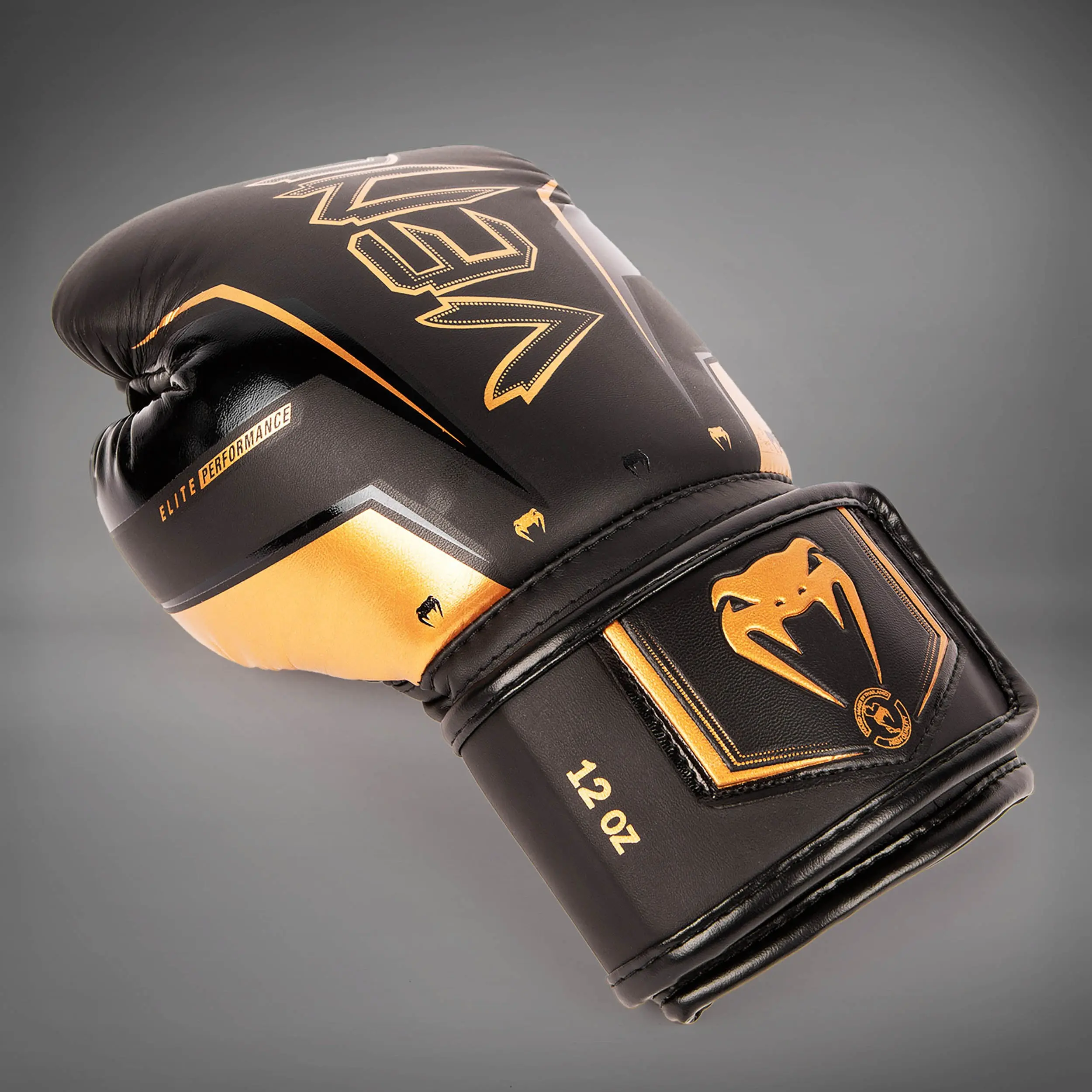 Venum Elite Evo Boxing Gloves - Black/Bronze, изглед отстрани на маншета