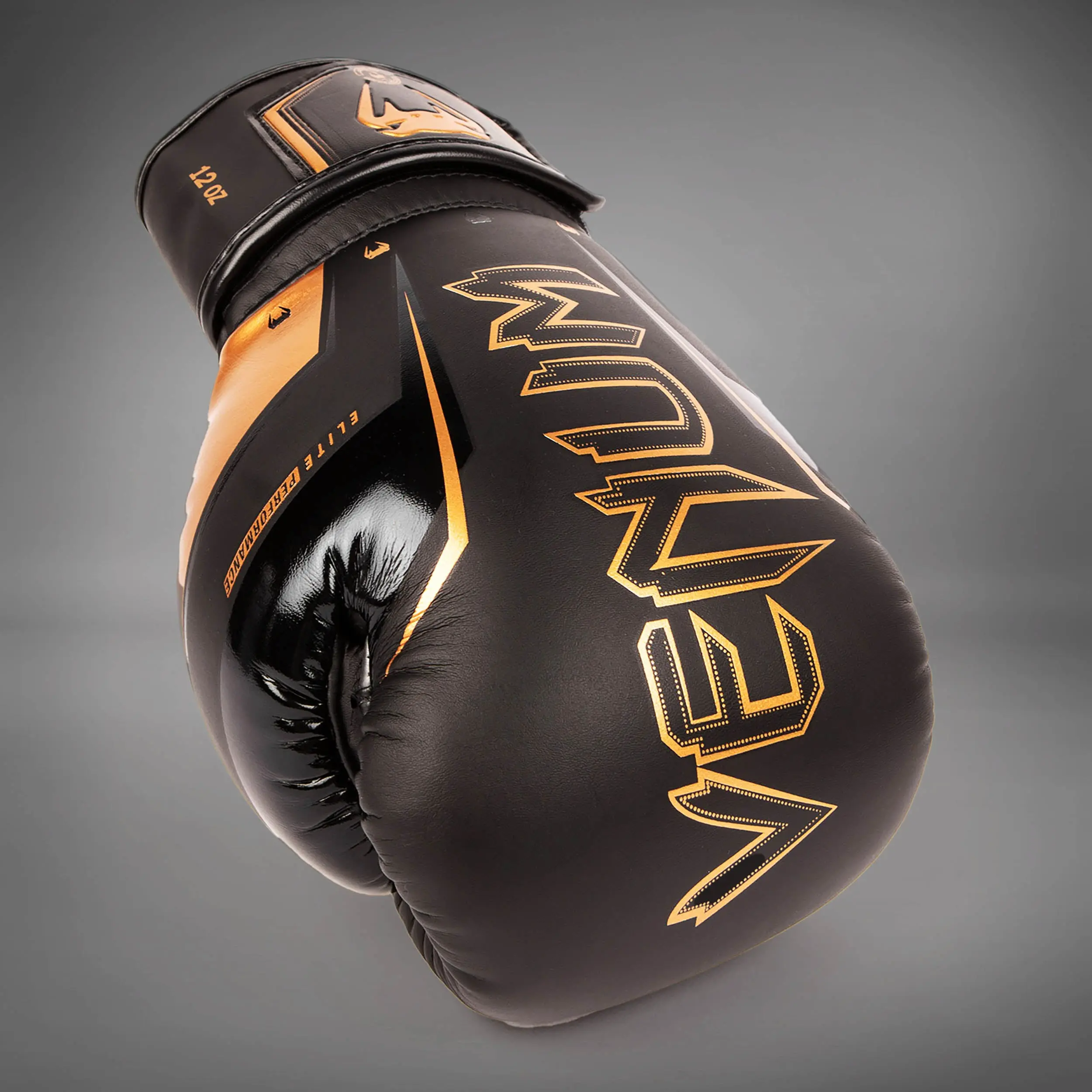 Venum Elite Evo Boxing Gloves - Black/Bronze, изглед отгоре на едната ръкавица