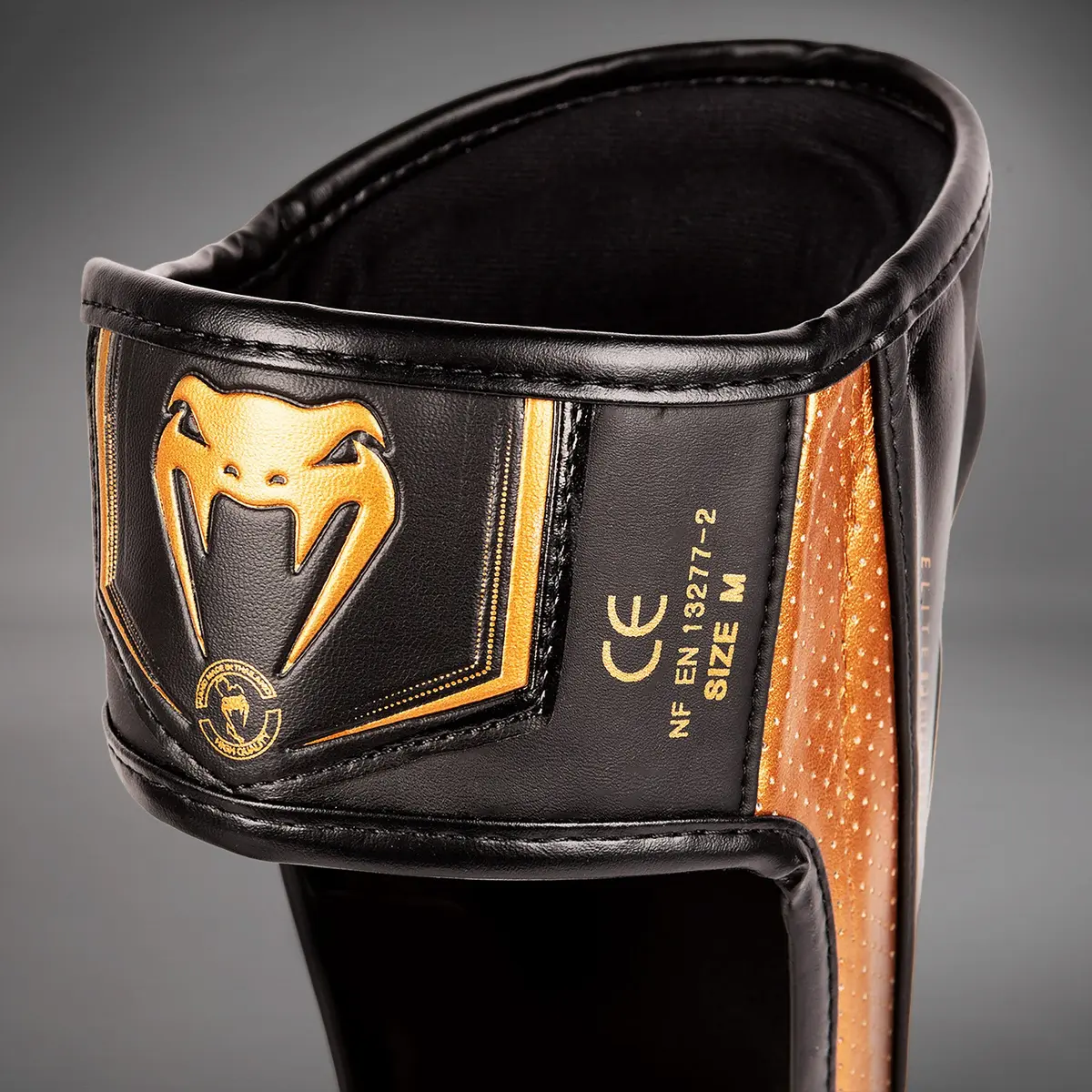Venum Elite Evo Shinguards - Black/Bronze етикет размер
