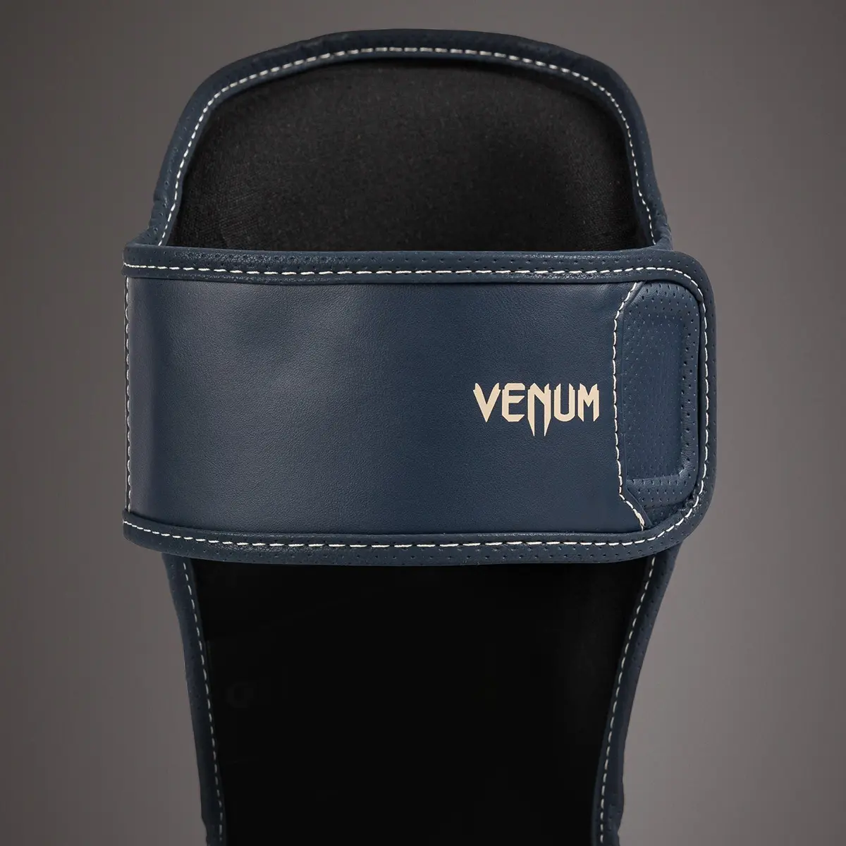 Venum Impact Evo Shin Guards - Icy Blue, преден изглед на горната част с лого