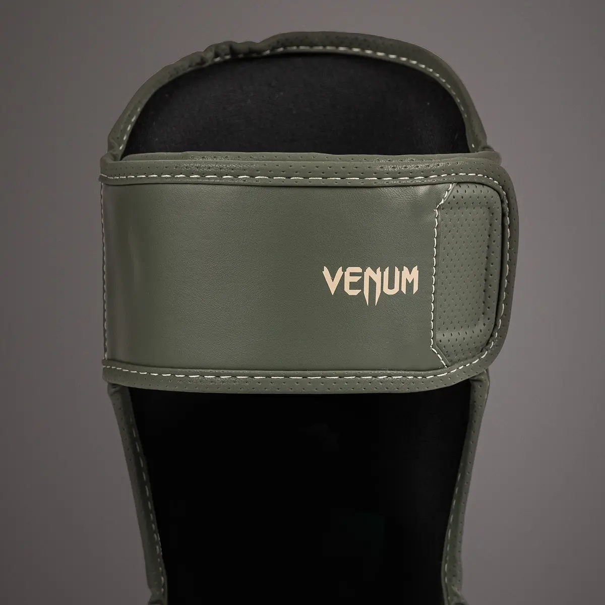 Venum Impact Evo Shin Guards - Military Green, преден изглед на горната част с лого