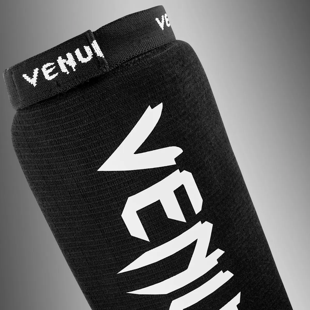 Venum Venum Kontact Shin Guards Without Foot - Black, близък план на горната част с лого