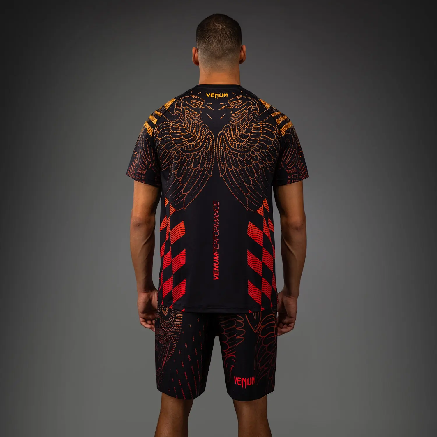 Venum Тениска Quetzal Fury T-Shirt - Black/Fury Red/Tangerine, заден изглед с шарка и лого