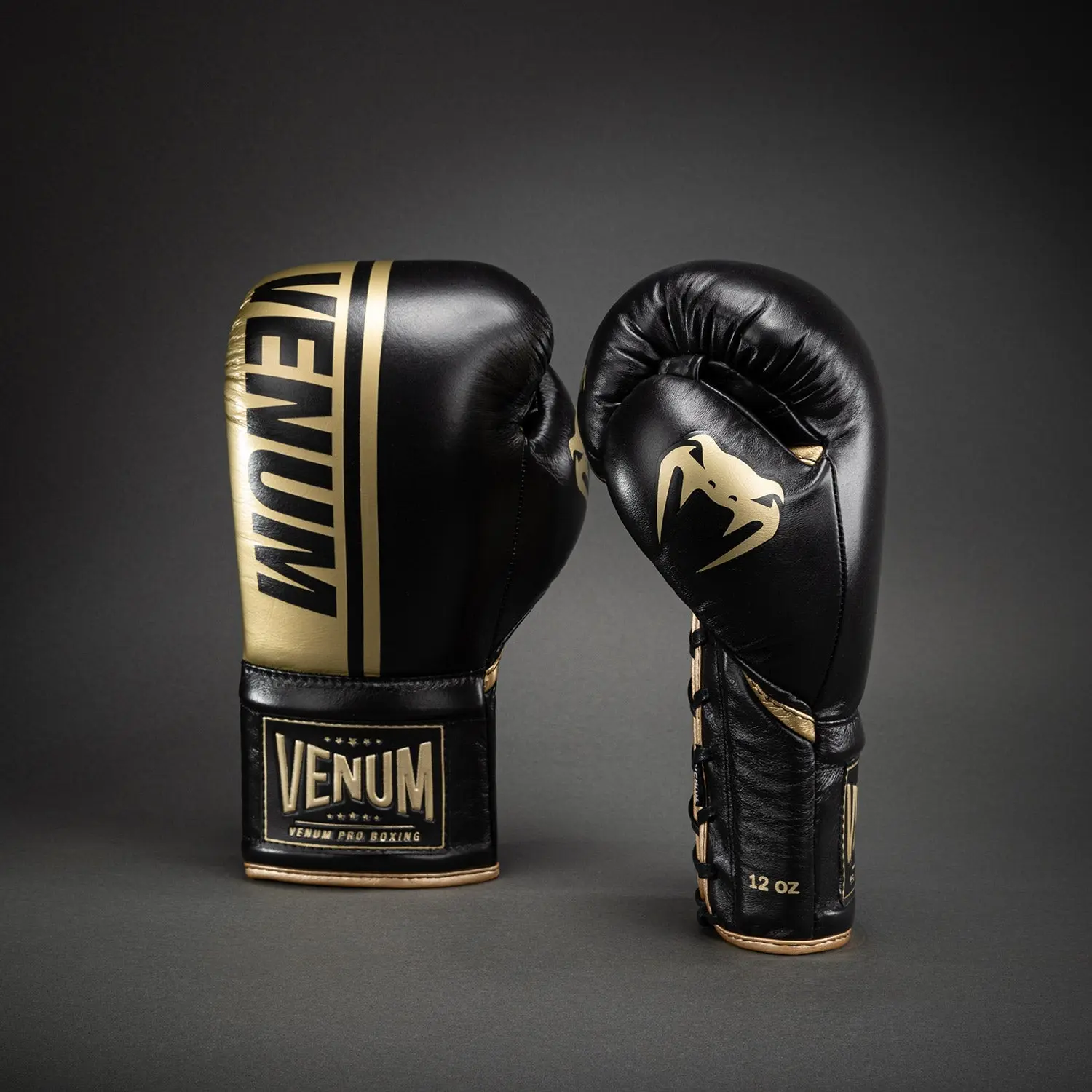 Venum Shield Pro Boxing Gloves with Laces - Black/Gold: две ръкавици, едната с връзки