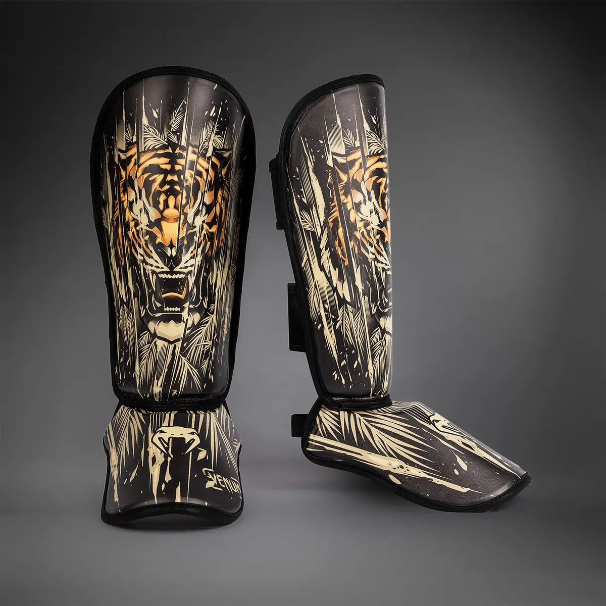 Venum Tiger Kids Shin Guards - Black/Neon Orang с отворен ремък